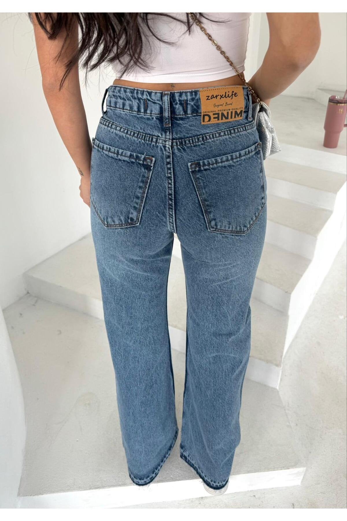 Yüksek Bel Yırtık Detaylı Bol Paça Kot Pantolon