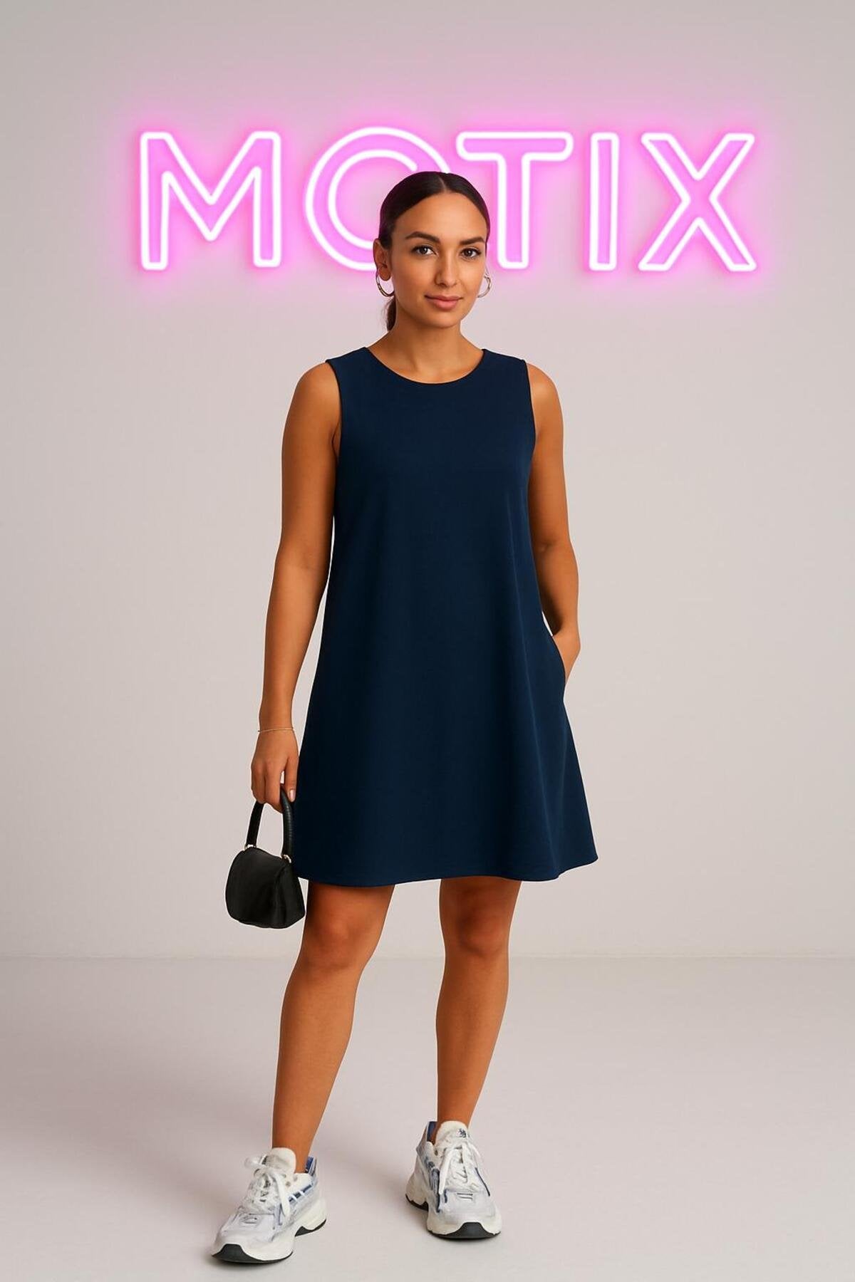 Basic Şıklığın Temsilcisi: Kolsuz Rahat Kesim Günlük Elbise